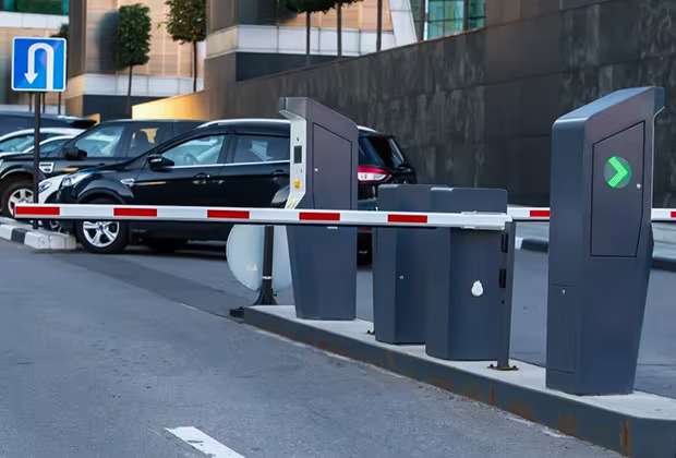 Gate barrier, card or ticket dispenser placed on the outside entrance for parking management